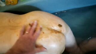 Smearing her body and ass with shit