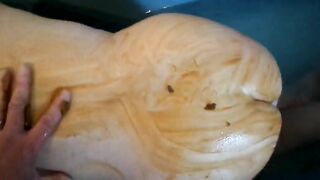 Smearing her body and ass with shit