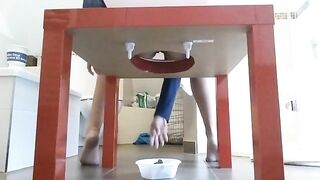 Girl takes a shit through the table into a bowl