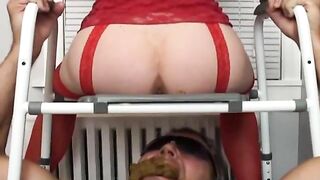 A man eats shit from a woman's ass over a radiator