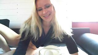 Sweet blonde milf in glasses poop teasing