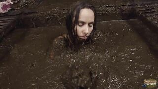 Hot girl playing in cowshit