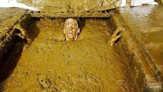 Betty submerging in cowshit