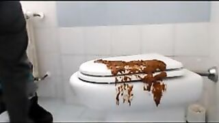 Brunette shitting on the cover of toilet