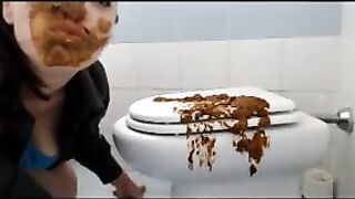 Brunette shitting on the cover of toilet