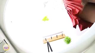 Young Asian girl pooping heavily in the toilet