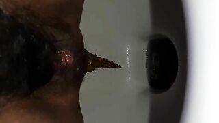 Lovely hairy lady pooping in sweet closeup