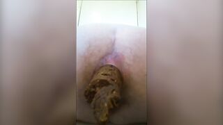 Beautiful lady shits long hard turd