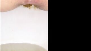 Girl shitting long hard yellow turd