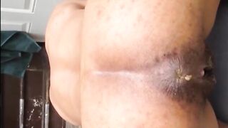 Hairy woman shitting doggy closeup