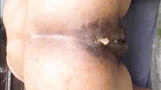 Hairy woman shitting doggy closeup