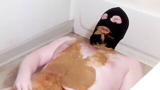 Girl in mask smears shit all over her body