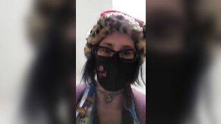 Masked lady pooping in the toilet