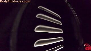 Girls in school uniforms sit at a table and play with their food