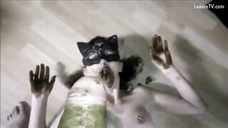 Woman in mask eats her own shit and piss on the floor
