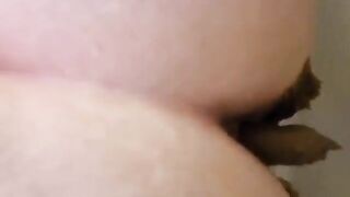 Woman sits on a toilet and takes a huge shit