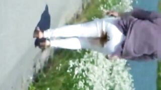 Walking outside in her dirty pants