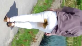 Walking outside in her dirty pants