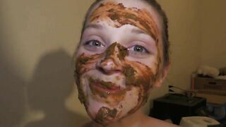 Skinny brunette gal smearing shit on her body and face