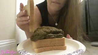 Cute gal in black dress making poop sandwich