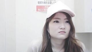 Girl in hat crouches down and takes a shit in public