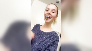 Skinny brunette gal eating shit