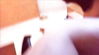 Mature woman masturbating with vibrator while shitting