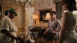 Woman pisses in a sink while wearing a hat