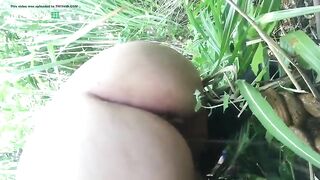 Massive ass girl pooping in the grass