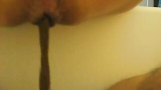 Yummy slut pooping on slave