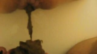 Yummy slut pooping on slave