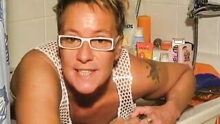 Milf in glasses and stockings pooping