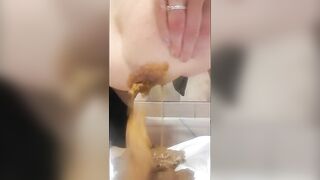 Girl takes a huge shit in a toilet and smears it all over herself