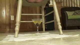 Busty babe shitting from wooden stool