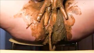 Woman fisting herself with shit