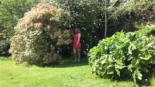 Cute looking girlfriend poops in the garden