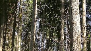 Blonde bends over and spreads her ass in the forest