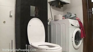 Woman squats on the toilet, preparing to take a massive shit