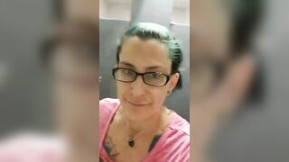 Mature brunette lady in glasses showing her poop