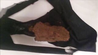 Black panties filled with shit
