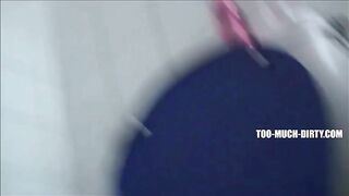 Blonde milf shitting in the toilet while standing