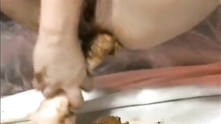 Slutty lady smearing shit on her sexy body