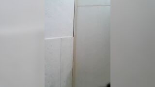 Cute Asian girl squats naked on the floor