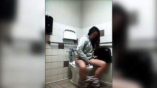 Brunette pooping on public toilet