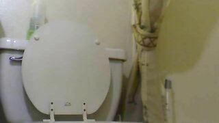 Milf talks aggressive while she shits in toilet