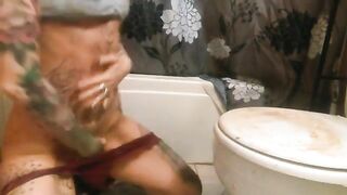 Tattooed chick ass fingering and shitting