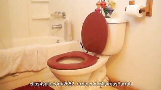 Woman takes a big shit on a toilet seat