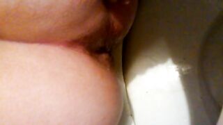 Hot booty lady shitting closeup