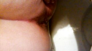 Hot booty lady shitting closeup