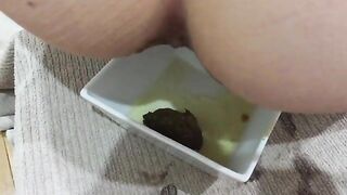 Slut pushes out plug while piss and shitting on it